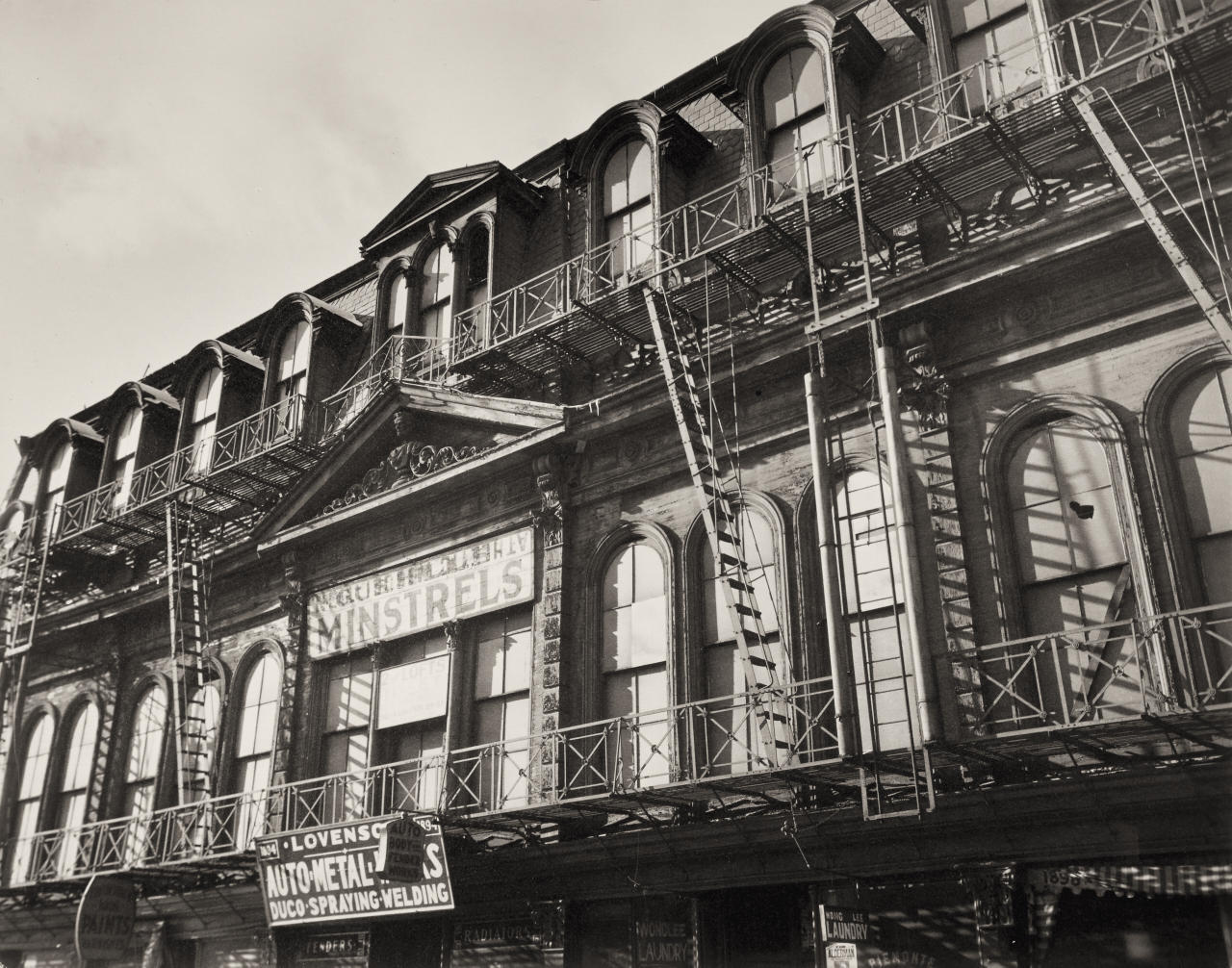 BERENICE ABBOTT (1898–1991) ‘Gus Hill's Minstrels: Park Avenue and 129th Streets, Manhattan’, December 19th, 1935