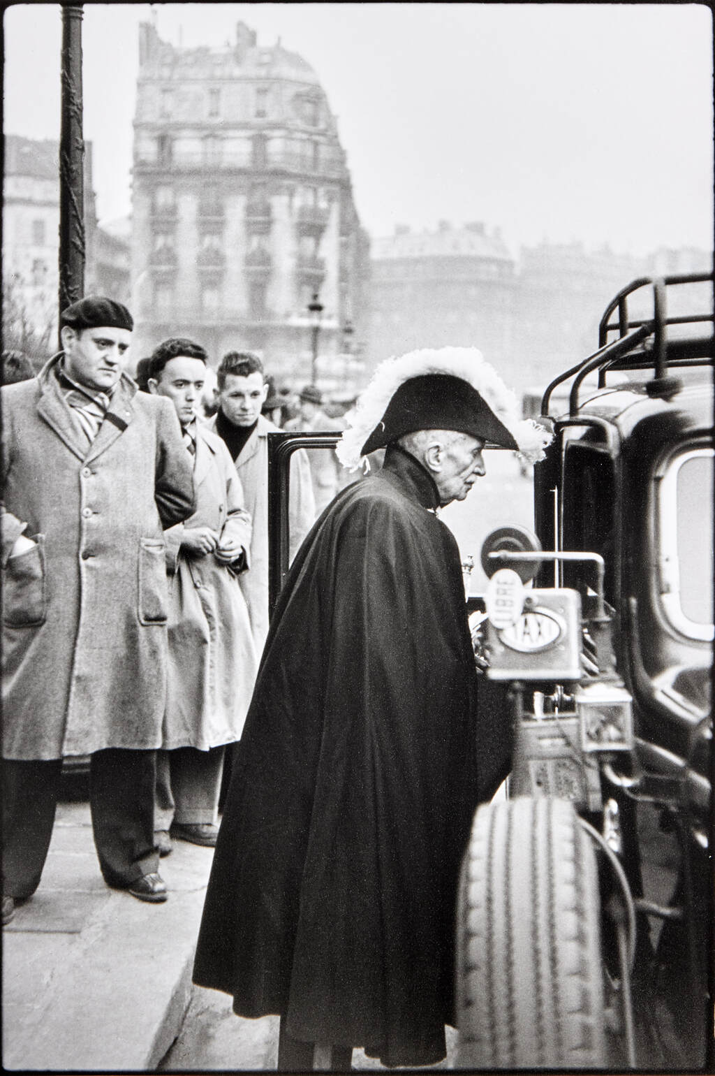 HENRI CARTIER-BRESSON (1908–2004) - A member of the French Academy on his way to a ceremony at Notre Dame, 1953