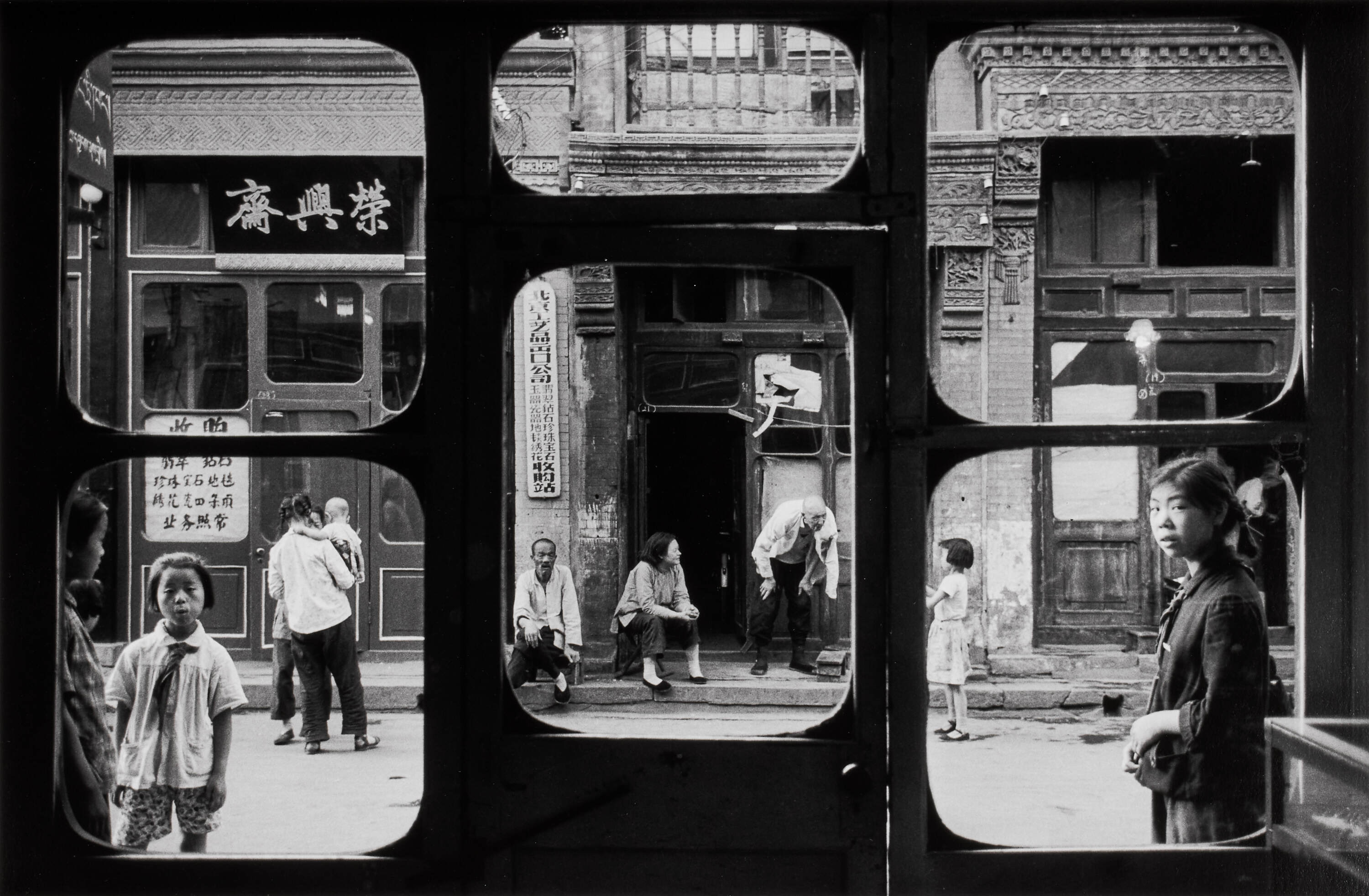 MARC RIBOUD (1923–2016) - ‘A street in Beijing as seen from inside an antique dealer's shop’, China 1965 *