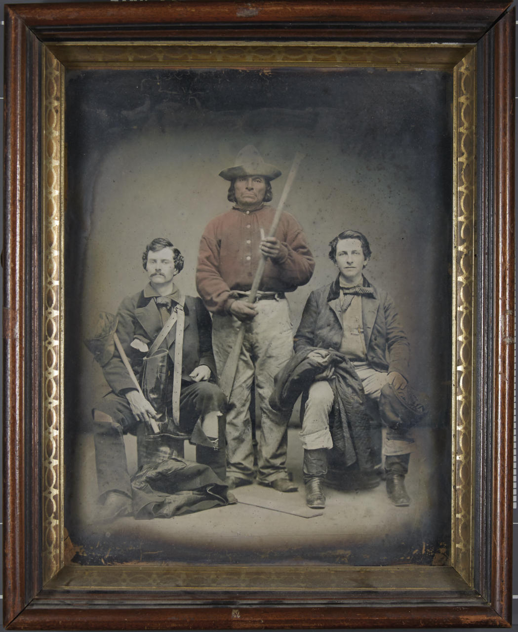 ANONYMOUS PHOTOGRAPHER Two explorers with their boatman (likely American Indian), USA c. 1858