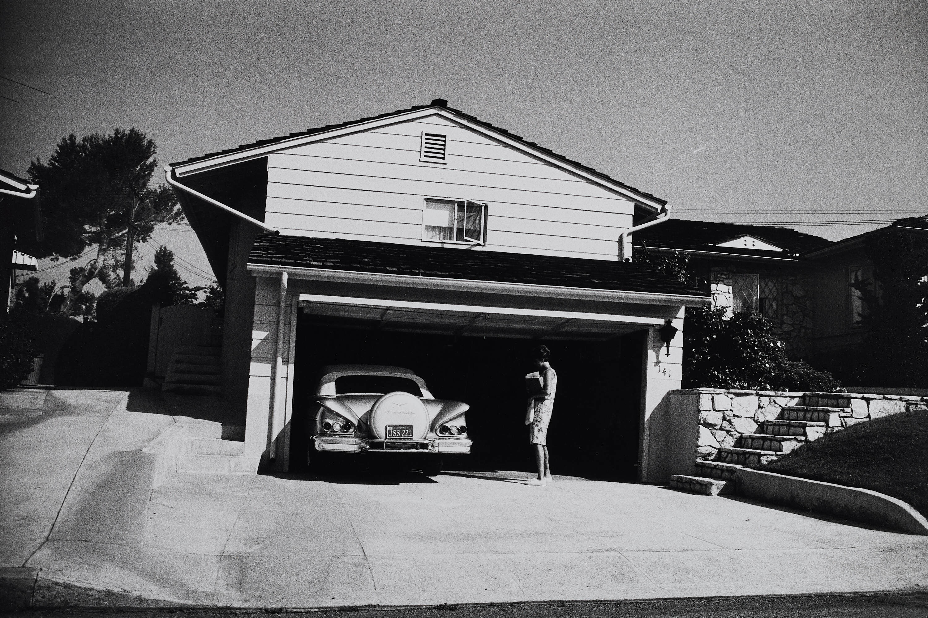 GARRY WINOGRAND (1928–1984) - Car in Garage, Near Carmel, California 1964