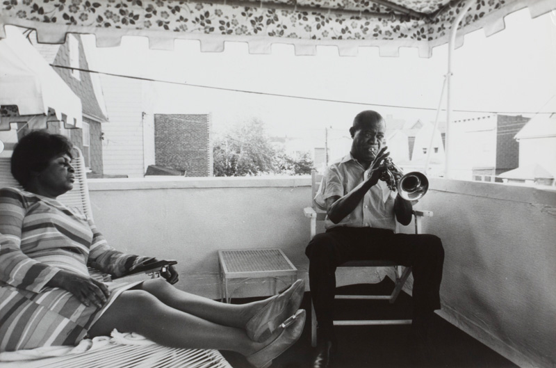 Louis Armstrong and his wife Lucille on the porch of their house, Ken Regan