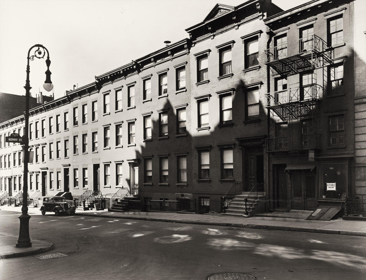 BERENICE ABBOTT (1898–1991) ‘Oliver Street, 13 1/2 to 29, Manhattan’, March 30th, 1937