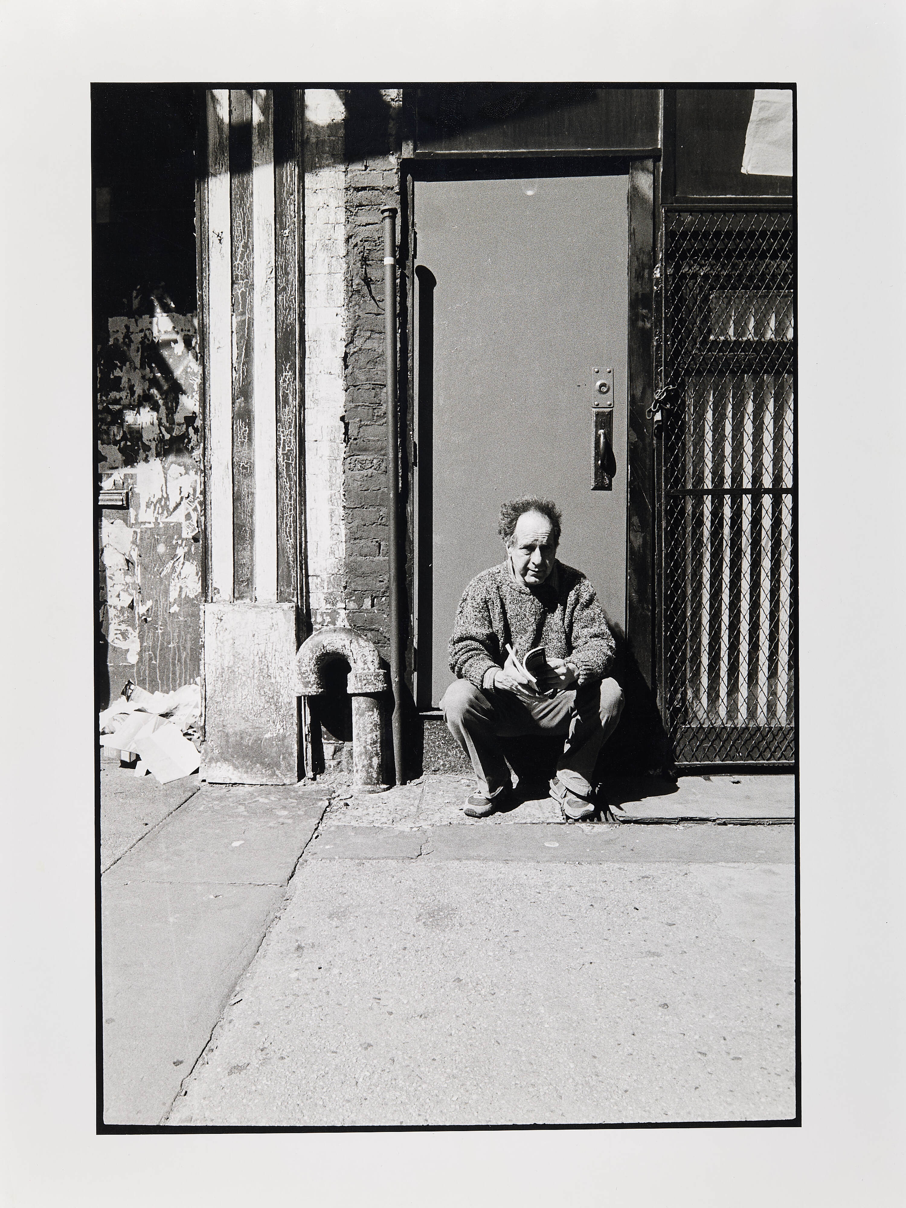 F.C. GUNDLACH (1926-2021) - Robert Frank in front of his studio, Bleecker Street, NYC 1985