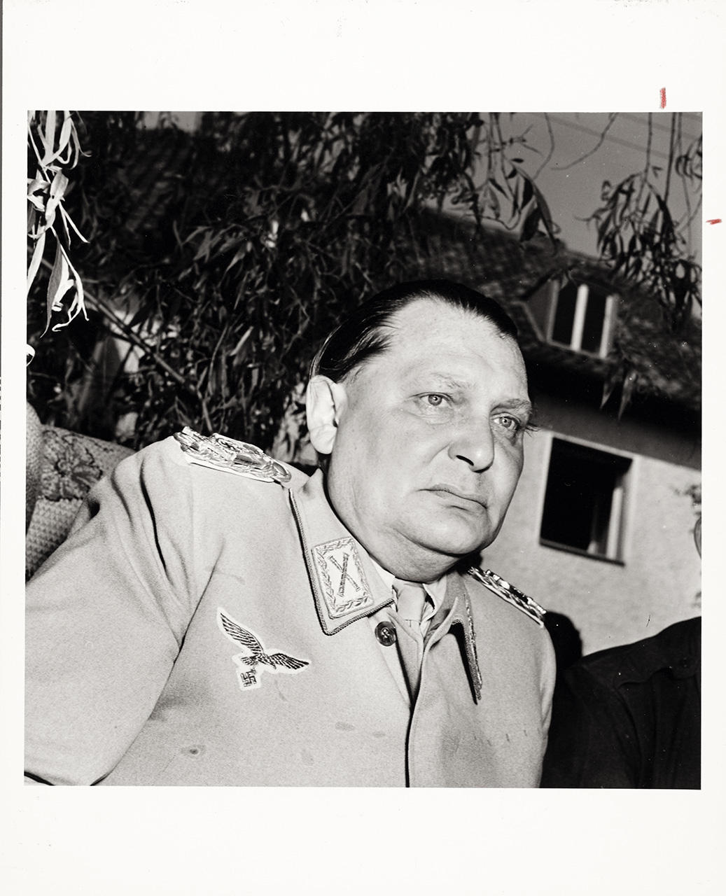 MARGARET BOURKE-WHITE (1904–1971) Hermann Göring sitting in a backyard garden, as he is questioned by more than 50 Allied war correspondents after being taken prisoner, May 1945