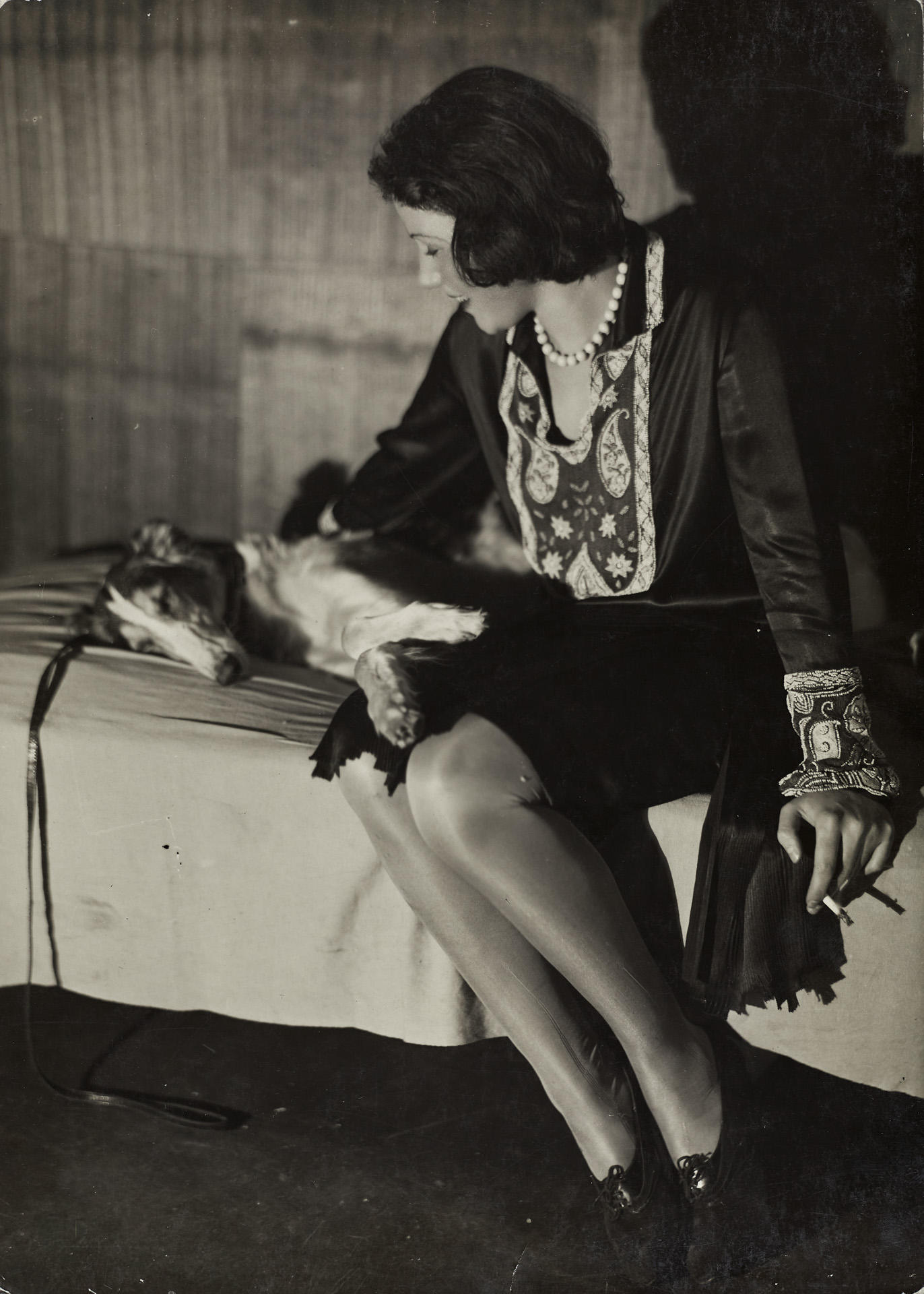 GERMAINE KRULL (1897–1985) Woman with dog, Paris c. 1930