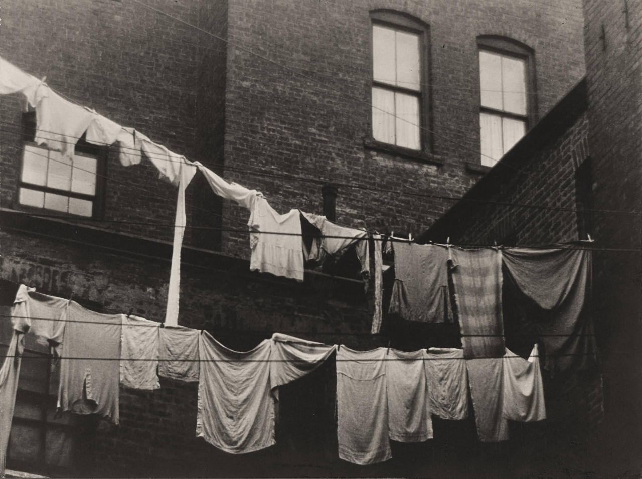 ANTON BRUEHL (1900–1982) Laundry hanging in inner courtyard, New York c. 1925