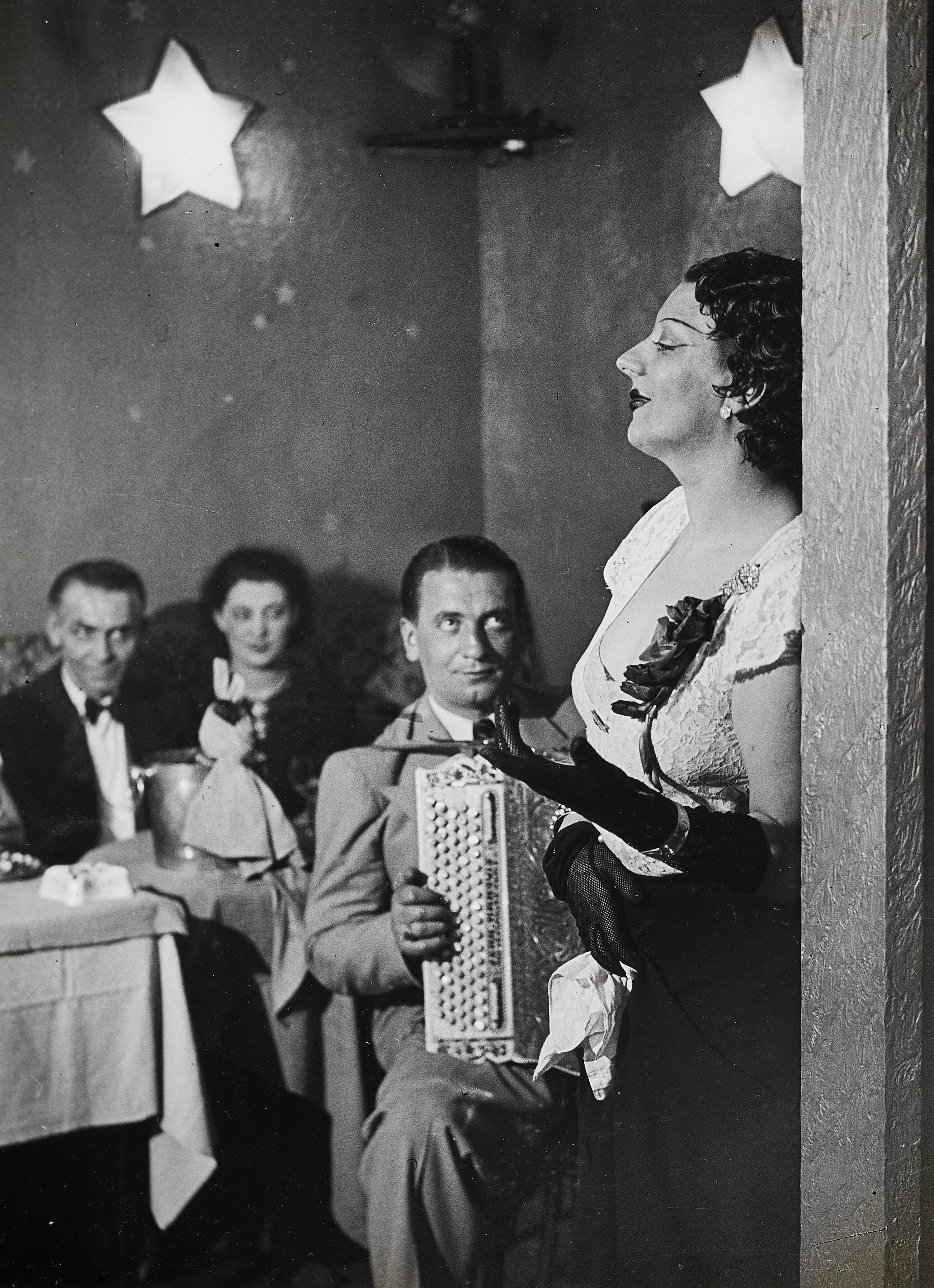 BRASSAÏ (1899–1984) - Kiki Singing at the Cabaret des Fleurs, Boulevard Montparnasse, 1932*
