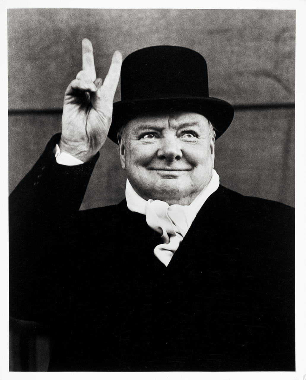ALFRED EISENSTAEDT (1898–1995) Winston Churchill flashes his trademark "V for Victory" sign, Liverpool 1951